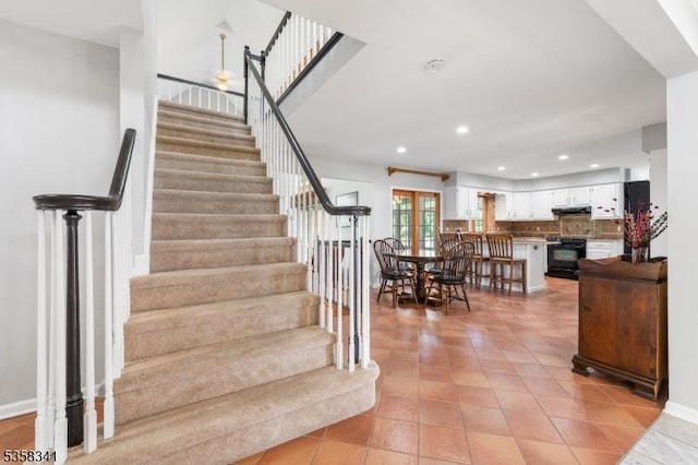 45 Wagner Ln, Hillsborough Twp, NJ 08844 - stairway featuring tile patterned flooring, recessed lighting, and baseboards