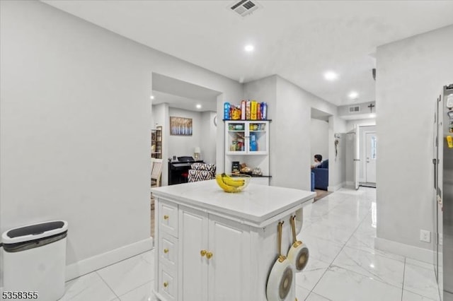 104 Hollywood Ave, East Orange City, NJ 07018 - kitchen with light marble finish floors, baseboards, white cabinets, light countertops, and recessed lighting