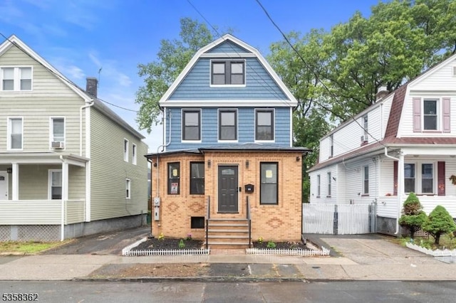 view of front of home featuring brick siding and entry steps