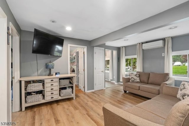 125 Schwarz Blvd, Jefferson Twp, NJ 07849 - living room with a wall unit AC, light wood-type flooring, baseboards, and recessed lighting