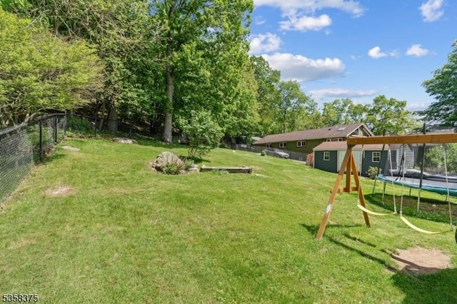 125 Schwarz Blvd, Jefferson Twp, NJ 07849 - view of yard featuring a trampoline and a playground