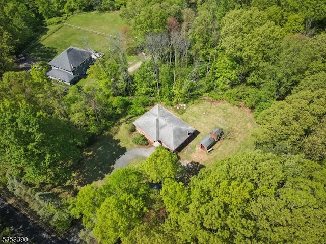 view from above of property with a forest