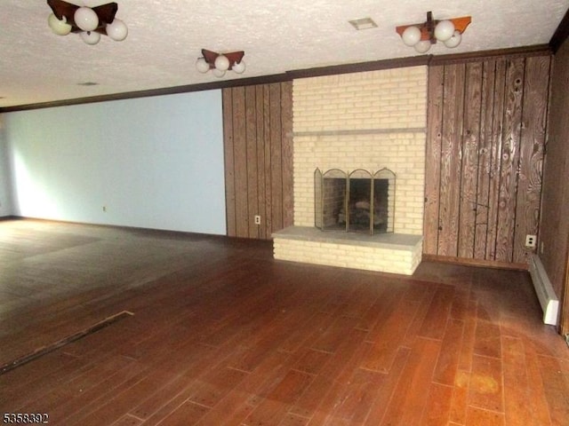 1601 Justin Pl, Mountainside Boro, NJ 07092 - unfurnished living room with ornamental molding, wood finished floors, a fireplace, and a textured ceiling