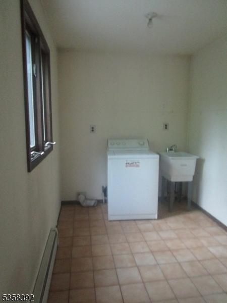 1601 Justin Pl, Mountainside Boro, NJ 07092 - laundry room with washer / dryer and a baseboard radiator