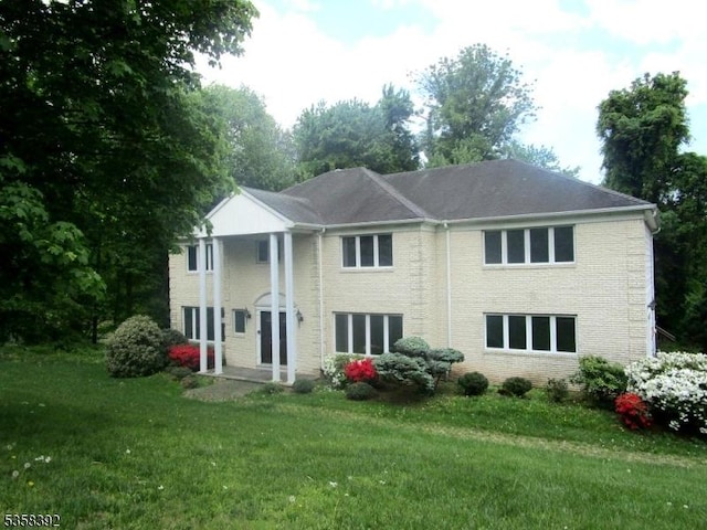 1601 Justin Pl, Mountainside Boro, NJ 07092 - back of property featuring a lawn and brick siding