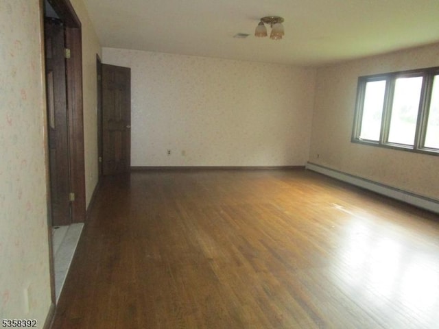 1601 Justin Pl, Mountainside Boro, NJ 07092 - unfurnished room with wood finished floors, a baseboard heating unit, and baseboards