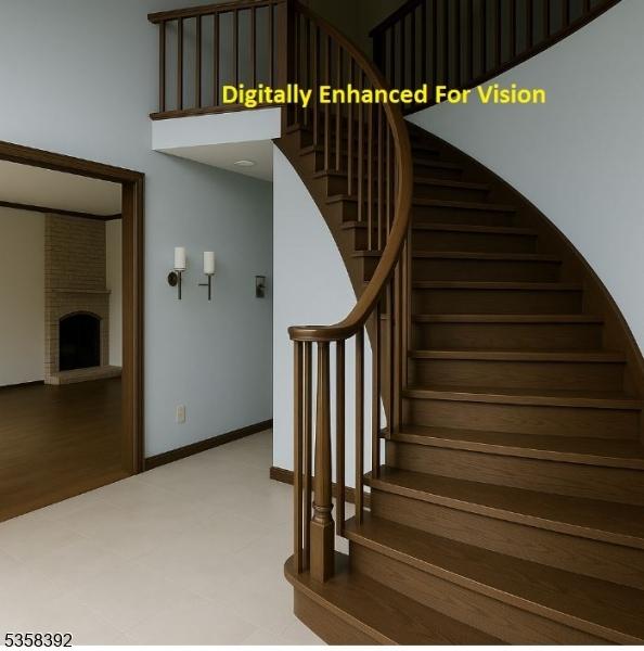1601 Justin Pl, Mountainside Boro, NJ 07092 - stairs featuring a towering ceiling, a fireplace with raised hearth, and baseboards