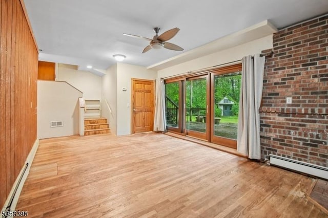 91 Hillcrest Rd, Warren Twp, NJ 07059 - unfurnished living room with wood finished floors, a ceiling fan, a baseboard radiator, stairway, and wood walls