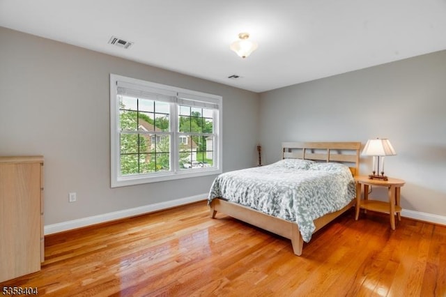9 Colgate Ct, Franklin Twp, NJ 08873 - bedroom with baseboards and wood finished floors