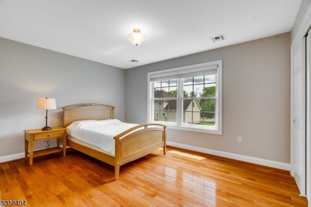 9 Colgate Ct, Franklin Twp, NJ 08873 - bedroom with baseboards, light wood-type flooring, and a closet