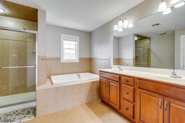 9 Colgate Ct, Franklin Twp, NJ 08873 - bathroom featuring a stall shower, tile patterned flooring, a bath, and double vanity