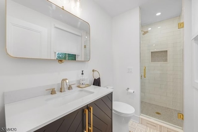 full bathroom featuring toilet, a shower stall, vanity, and recessed lighting