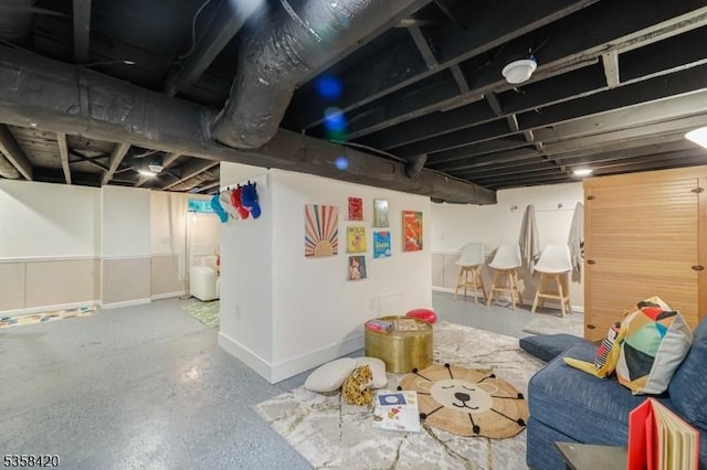finished basement featuring baseboards