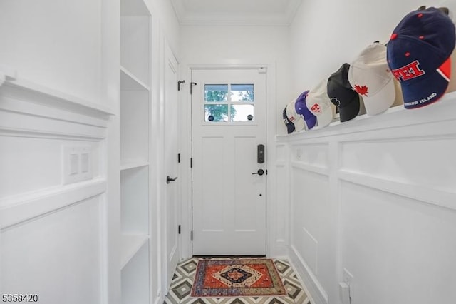 entryway featuring crown molding