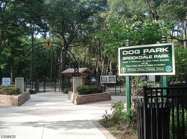 view of property's community with a gate and fence
