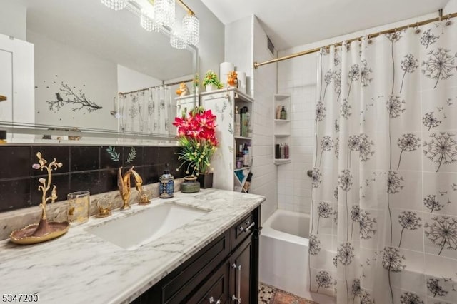 full bath with shower / tub combo with curtain and vanity