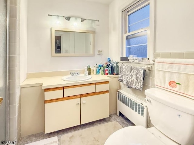 24 Hutton Ave Unit 75, West Orange Twp, NJ 07052 - bathroom with radiator heating unit, toilet, and vanity