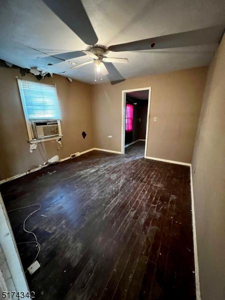 80 Seeley Ave, Keansburg Boro, NJ 07734 - empty room with hardwood / wood-style flooring, a ceiling fan, and baseboards