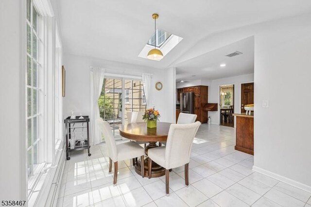 6 Mount Pleasant Rd, Mendham Twp, NJ 07960 - dining area featuring a skylight, vaulted ceiling, baseboards, and light tile patterned flooring