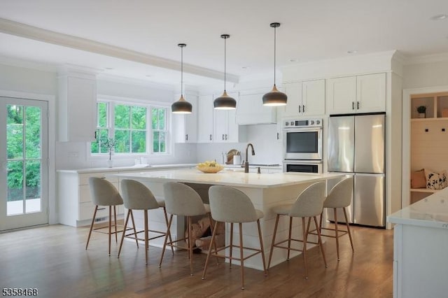 237 Appletree Ln, Mountainside Boro, NJ 07092 - kitchen with appliances with stainless steel finishes, white cabinets, crown molding, a sink, and an island with sink