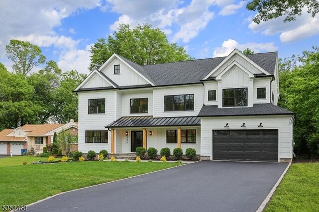 237 Appletree Ln, Mountainside Boro, NJ 07092 - modern farmhouse with board and batten siding, a garage, and asphalt driveway