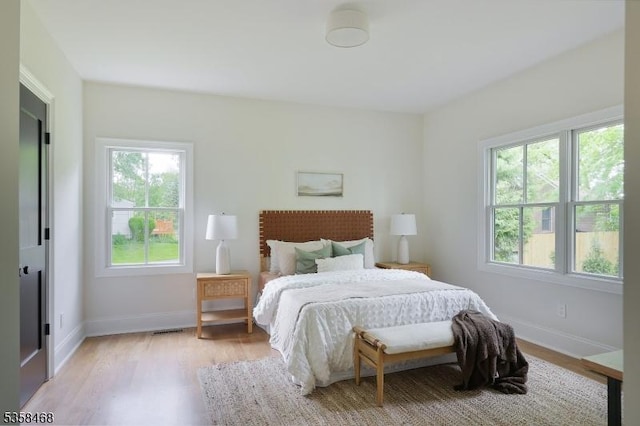 237 Appletree Ln, Mountainside Boro, NJ 07092 - bedroom featuring multiple windows, light wood-type flooring, and baseboards