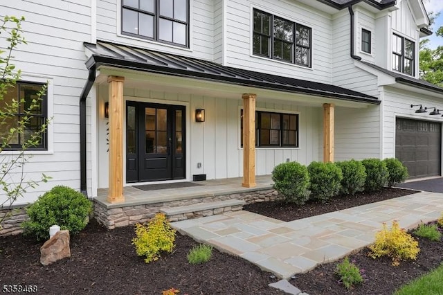 237 Appletree Ln, Mountainside Boro, NJ 07092 - property entrance featuring a porch, a standing seam roof, board and batten siding, and a garage