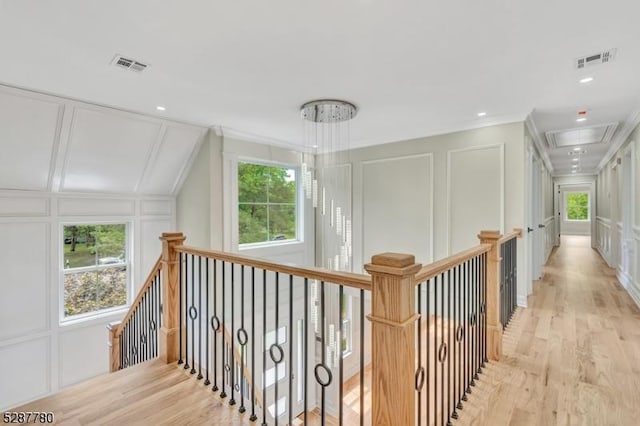 737 Wingate Dr, Bridgewater Twp, NJ 08807 - hall featuring a decorative wall, attic access, ornamental molding, an upstairs landing, and light wood-style floors