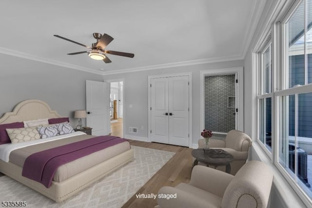737 Wingate Dr, Bridgewater Twp, NJ 08807 - bedroom featuring wood finished floors, crown molding, baseboards, ceiling fan, and a closet