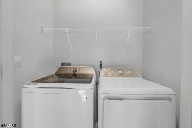 washroom with washer and clothes dryer
