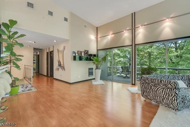 1178 Johnston Dr, Watchung Boro, NJ 07069 - living area with a high ceiling and wood finished floors