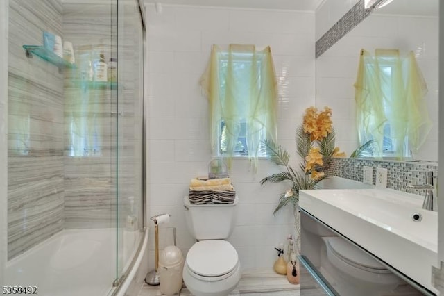 1178 Johnston Dr, Watchung Boro, NJ 07069 - full bath with tile walls, toilet, shower / bath combination with glass door, and vanity