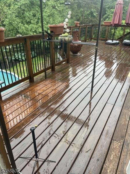 wooden deck featuring a swimming pool