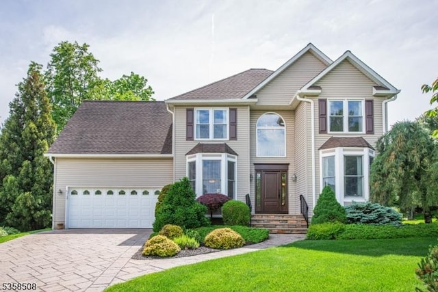 2 Jolie Ct, Boonton Town, NJ 07005 - view of front facade featuring driveway, a front lawn, and an attached garage