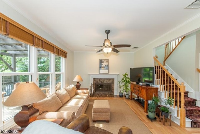 2 Jolie Ct, Boonton Town, NJ 07005 - living room featuring light wood finished floors, ceiling fan, stairway, a premium fireplace, and crown molding