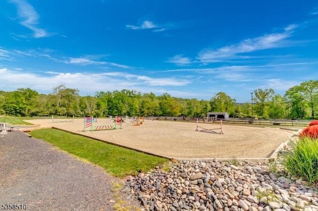 view of playground featuring an enclosed horse arena