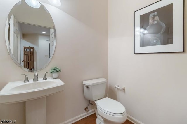 618 Turlington Ct, Livingston Twp, NJ 07039 - half bath with toilet, baseboards, and wood finished floors