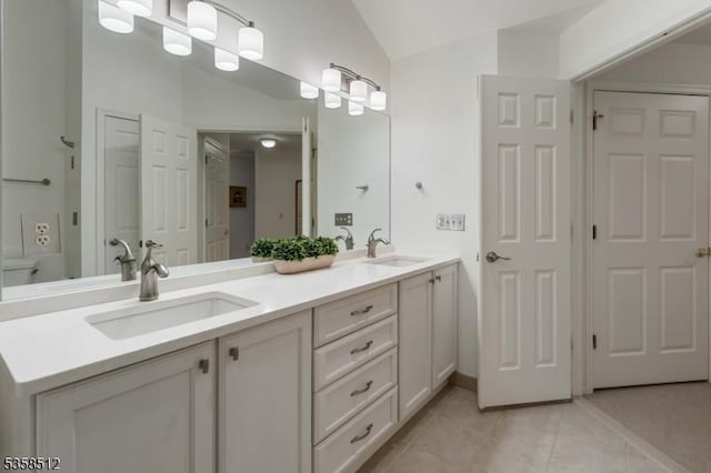 618 Turlington Ct, Livingston Twp, NJ 07039 - bathroom with tile patterned flooring, vaulted ceiling, and double vanity