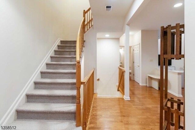 618 Turlington Ct, Livingston Twp, NJ 07039 - stairs featuring wood finished floors, baseboards, and recessed lighting