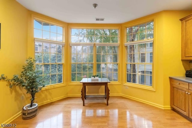 618 Turlington Ct, Livingston Twp, NJ 07039 - sunroom / solarium with plenty of natural light, wood finished floors, and baseboards