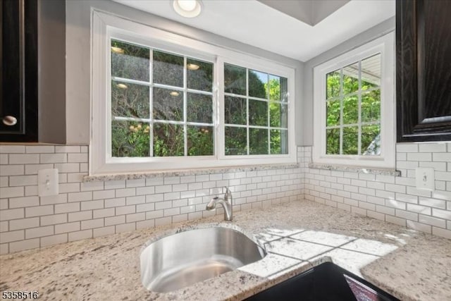 24 Stevens Ct, Bedminster Twp, NJ 07921 - kitchen with backsplash, a sink, and light stone counters