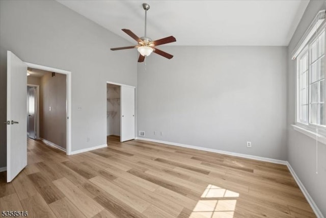 24 Stevens Ct, Bedminster Twp, NJ 07921 - unfurnished bedroom featuring light wood-type flooring, baseboards, high vaulted ceiling, a spacious closet, and ceiling fan