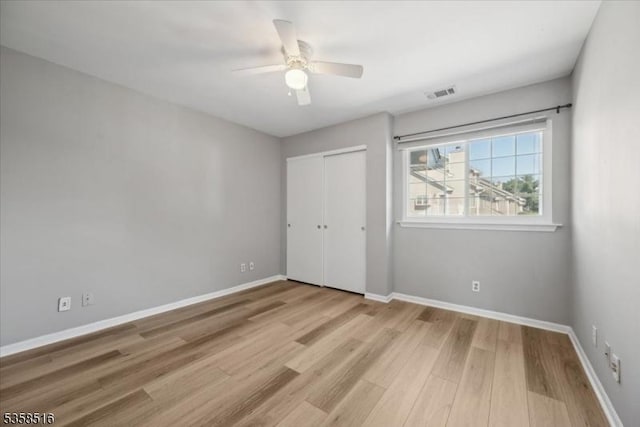 24 Stevens Ct, Bedminster Twp, NJ 07921 - unfurnished bedroom featuring wood finished floors, baseboards, a closet, and a ceiling fan