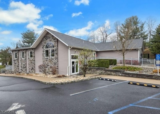 24 Stevens Ct, Bedminster Twp, NJ 07921 - view of front of property featuring uncovered parking and stone siding