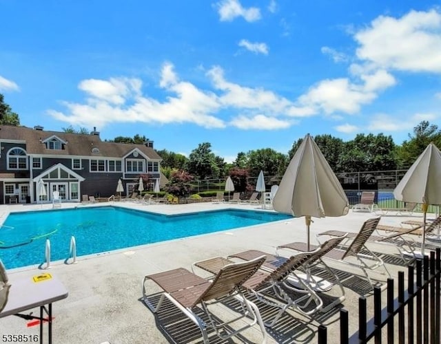 24 Stevens Ct, Bedminster Twp, NJ 07921 - community pool with a patio area and view of scattered trees
