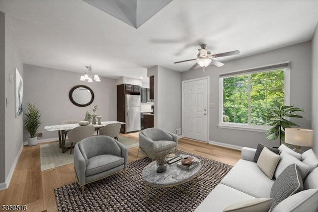 24 Stevens Ct, Bedminster Twp, NJ 07921 - living area featuring a chandelier, light wood-type flooring, baseboards, and ceiling fan