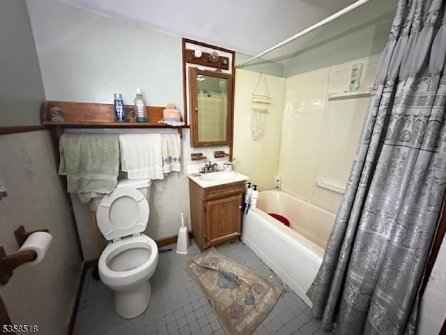 bathroom with shower / bathtub combination with curtain, toilet, vanity, and tile patterned floors