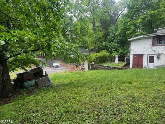 view of yard featuring stairs