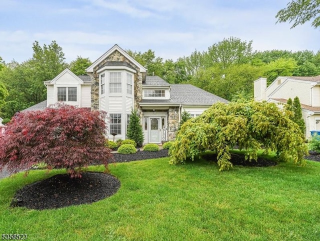 40 Nathan Dr, Old Bridge Twp, NJ 08857 - view of front of house featuring stone siding and a front lawn
