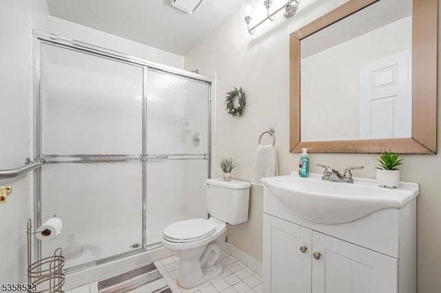 40 Nathan Dr, Old Bridge Twp, NJ 08857 - bathroom featuring a stall shower, toilet, vanity, and tile patterned flooring